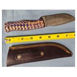 Drop blade knife w/carved wood handle.