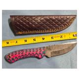 Straight blade knife w/serrated spine.