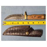 Trailing point blade knife w/guard. Jimped spine.