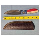 Drop point knife w/finger choil in blade base.