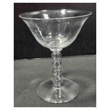 Four bead tall flared glass sherbet dish. 5" tall.