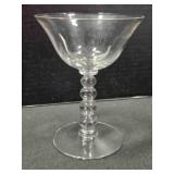 Four bead tall flared glass sherbet dish. 5" tall.