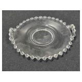 Glass under dish. Candlewick style. 5" diameter.