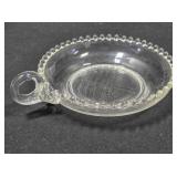 Glass nappy dish; Candlewick style; Single handle