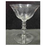 Four bead tall flared glass sherbet dish. 5" tall.