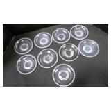 11 glass saucers. Candlewick pattern.