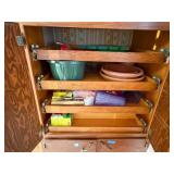 Cabinet Contents- lawn decor, planters, traps