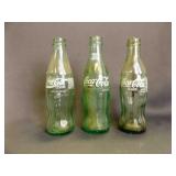 2 8oz. And One 6ï¿½oz. Green Coca-Cola Bottles
