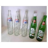3 Pepsi & 2 7-UP bottles