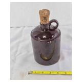Brown crockery Jug w/stamped cork stopper; 6'