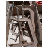 box of large C-clamps and hammers