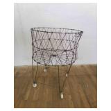 Vintage wire Laundry Cart-has a lean but rolls nic