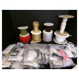Spools of Rick rack, cording, small bags of elasti
