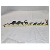 11 small plastic figurines; 6 dinosaurs