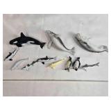 11 Sea life figurines; whales, sharks, penguins