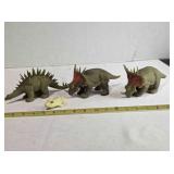 3 soft rubber dinosaurs; 1 has a tear