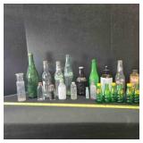 22 vintage bottles; some with content