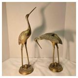 2 brass cranes, possibly solid, 20" & 12" tall