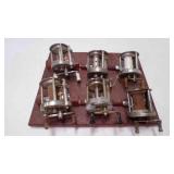 6 Baitcasting Fishing Reels Zip Tied to Display