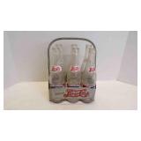 7 Vintage Pepsi-Cola Bottles And Metal Carrier