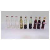9 Vintage Mini Coca-Cola Glass Souvenir Bottles