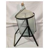 Vintage 5-gallon carboy bottle in tilting cradle