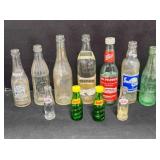 11 vintage pop bottles; Suncrest Soda, Dr. Pepper