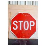 Metal Stop sign with bullet holes