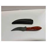 Tang Skinner Knife with burnt orange handle and a