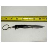 Handcrafted black and white pocket knife keychain