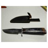 Demascus steel hunting knife w/ black wood handle