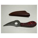 Skinner knife w/finger hole and multicolor carved