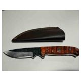 Fixed blade hunting knife w/ burnt orange carved