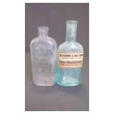 (2) Antique Embossed Glass Apothecary Bottles