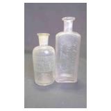 (2) Antique Embossed Glass Apothecary Bottles