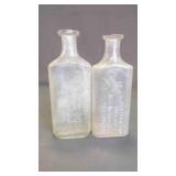 (2) Antique Embossed Glass Apothecary Bottles