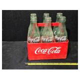 6 pack Coca-Cola bottles & plastic carrier