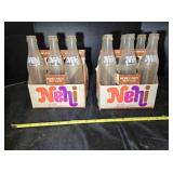 9 vintage 10 oz. Nehi bottles w/2 paper carriers