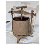Antique cast iron press w/strainer basket
