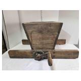 Vintage wooden apple crusher on detachable base