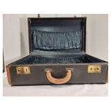 Hard side suitcase, stitched leather edges