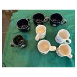 box of assorted coffee mugs