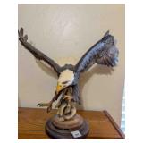 Eagle statue on wood base
