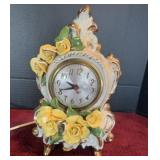 Porcelain table or shelf clock with flowers