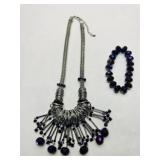 Silver tone statement necklace w/dangling metal ri