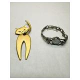 Gold Tone Cat Brooch w/ dangle legs, marked JJ,