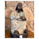 Bronze sculpure of Native Woman seated,