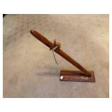 Wood peace pipe on wood stand