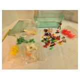 Plastic container w/plastic toy pieces