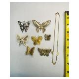 7 Butterfly Brooches, 1 necklace-brooches marked